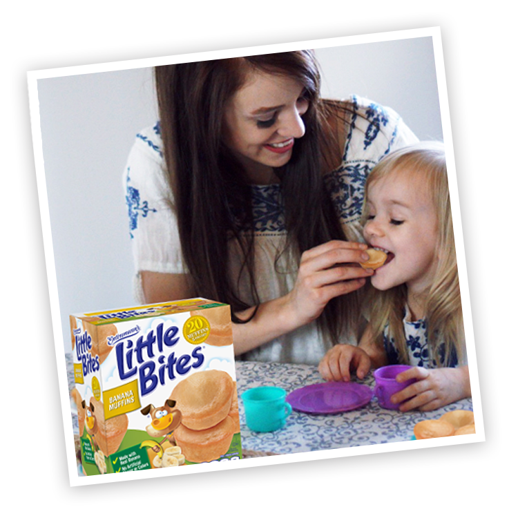 Mother and child with Little Bites Banana muffins package