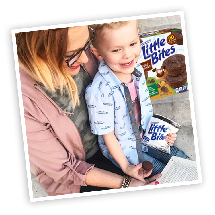 Mother and child with Little Bites Fudge Brownie muffins package and pouch