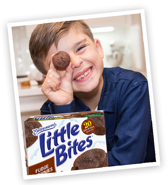 Child with Little Bites Fudge Brownie muffins package