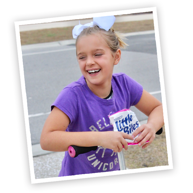 Child with Little Bites Strawberry Yogurt muffins pouch